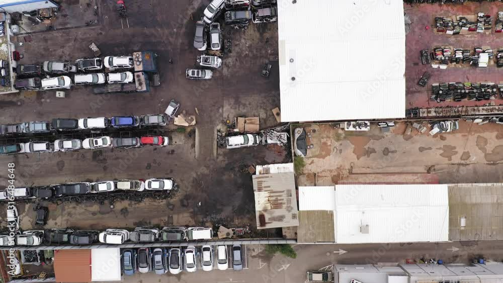 Large Salvage Car parts and Vehicles lot, Aerial view. Large Salvage Car parts and Vehicles lot, Aerial view.