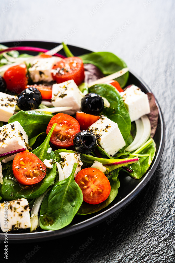 Fresh greek salad - feta cheese, tomato, lettuce, black olives and onion Fresh greek salad - feta cheese, tomato, lettuce, black olives and onion
