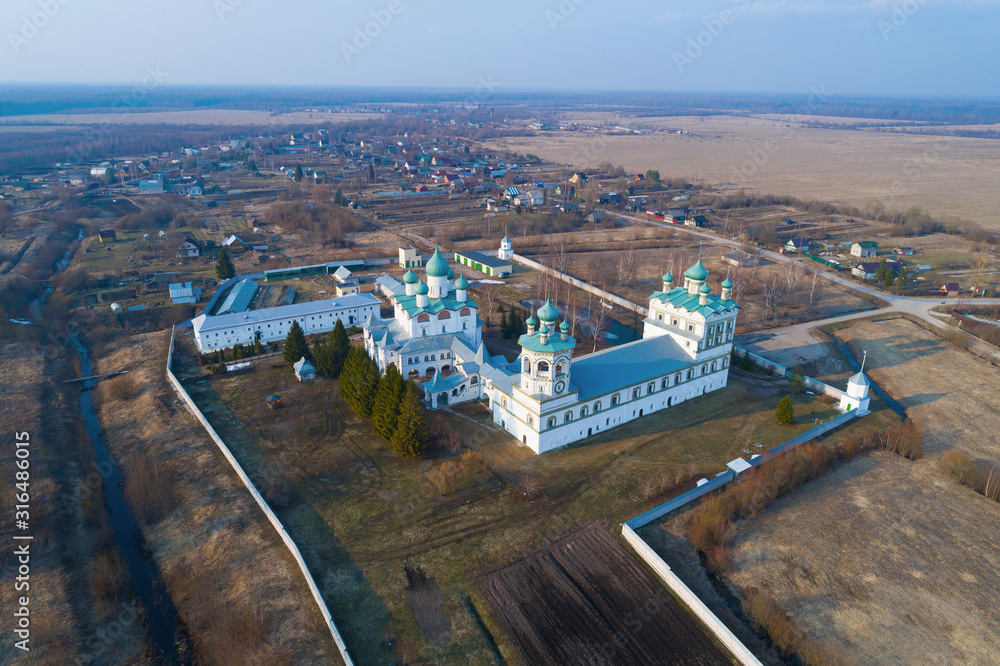 Nikolo-Vyazhishchskiy monastery in the April landscape (aerial photography). Vyazhishchi, Novgorod region. Russia