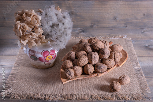 walnut and decoration stand on the table photo