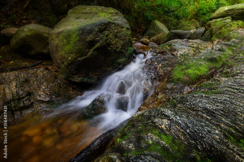 The waterfall in the forest with soft light The waterfall in the forest with soft light
