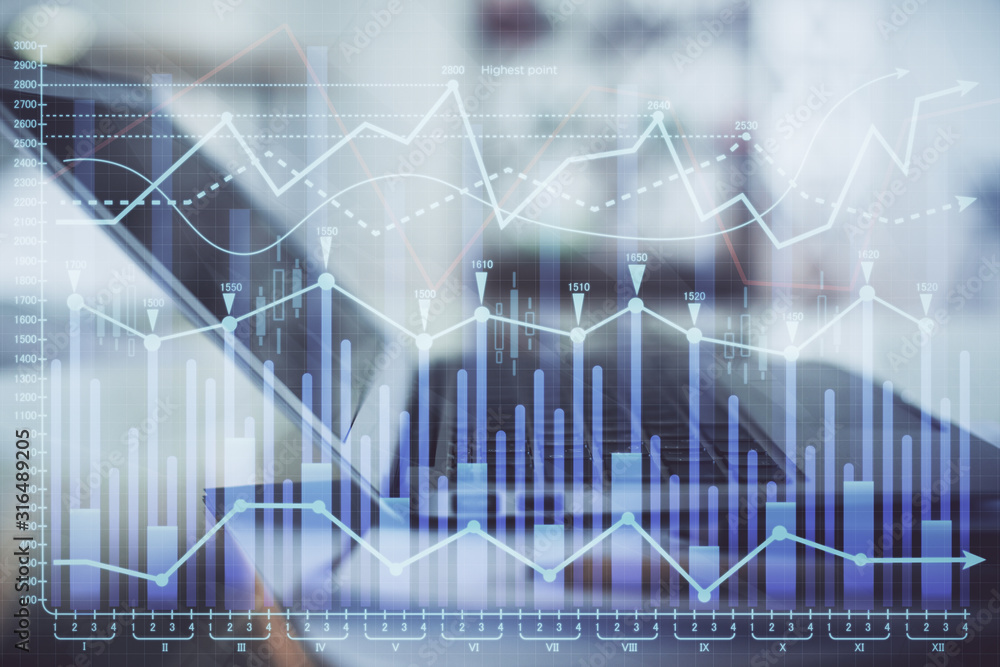 Forex graph hologram on table with computer background. Double exposure. Concept of financial markets. Forex graph hologram on table with computer background. Double exposure. Concept of financial markets.