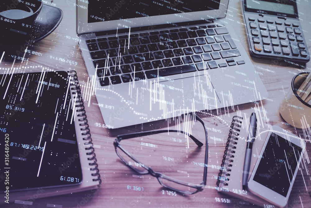 Forex market graph hologram and personal computer on background. Double exposure. Concept of investment. Forex market graph hologram and personal computer on background. Double exposure. Concept of investment.