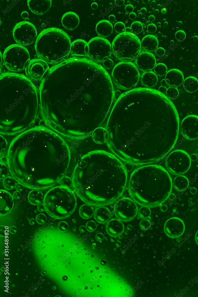 green cooking oil bubbles in water
