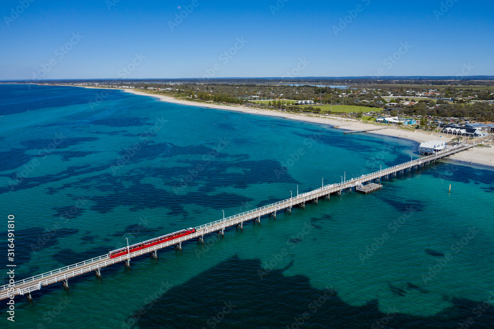 Aerial view of the train on Busselton pier, the worlds longest wooden structure; Busselton is 220km south west of Perth in Western Australia