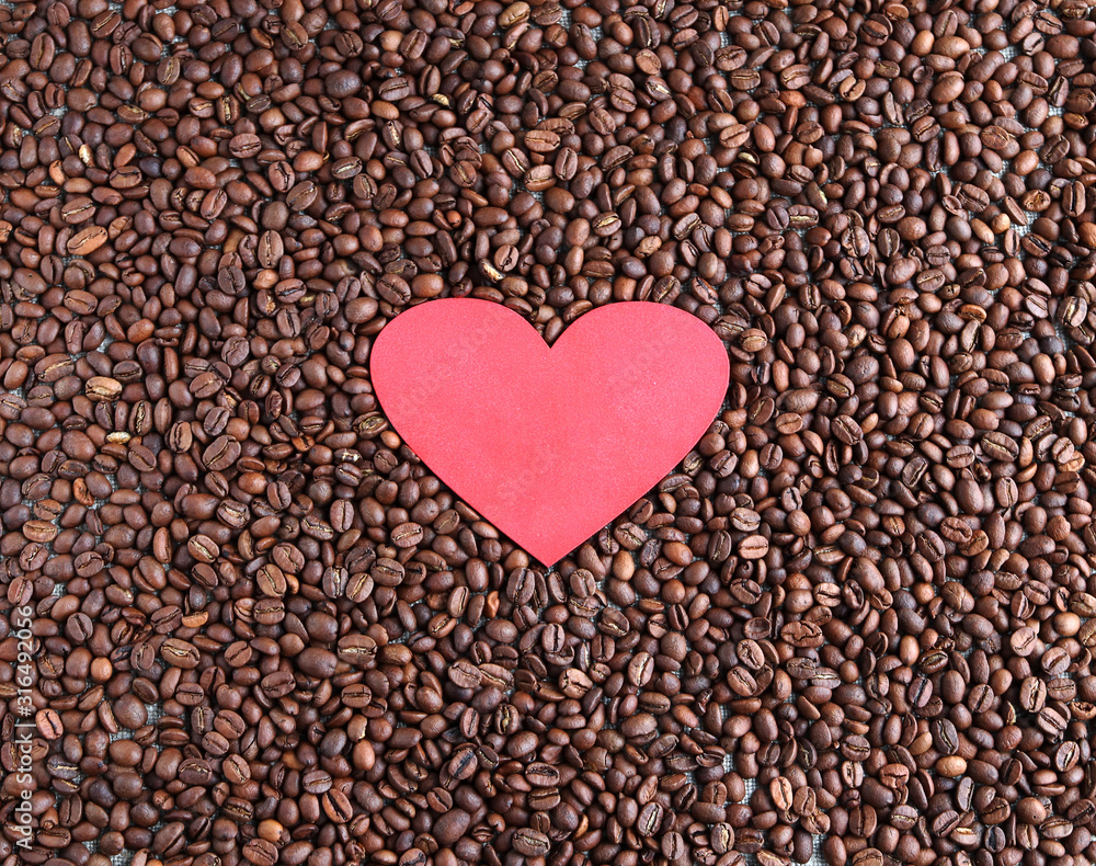 Red heart on coffee beans Red heart on coffee beans