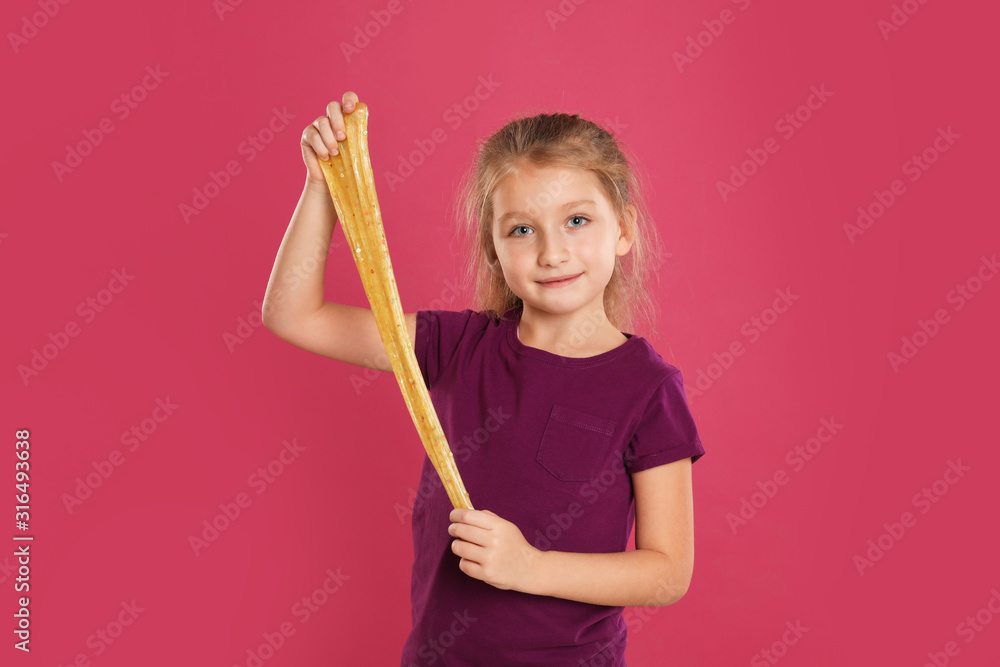 Little girl with slime on pink background Little girl with slime on pink background