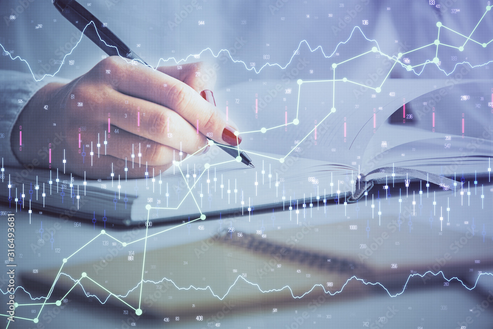 Multi exposure of woman's hands making notes with forex graph hologram. Concept stock market analysis. Multi exposure of woman's hands making notes with forex graph hologram. Concept stock market analysis.