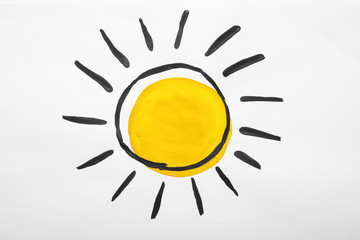 Child's painting of sun on white paper