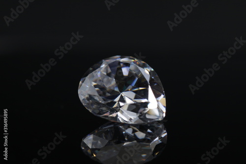 Close up shoot of shinny diamond that faceted to pear shapes isolated background