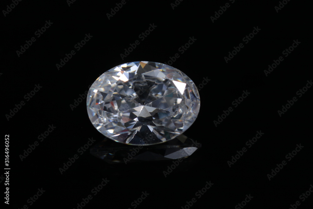 Briliant sparkling clear diamond, close up shoot on isolated background Briliant sparkling clear diamond, close up shoot on isolated background