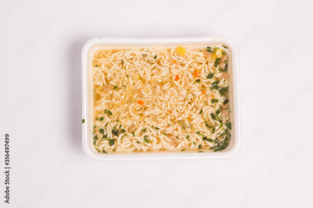 Instant noodles on a white background top view Instant noodles on a white background top view