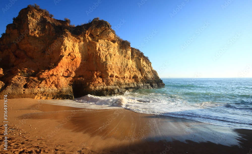 Tide coming in on a beach, near Lagos, Algarve, Portugal