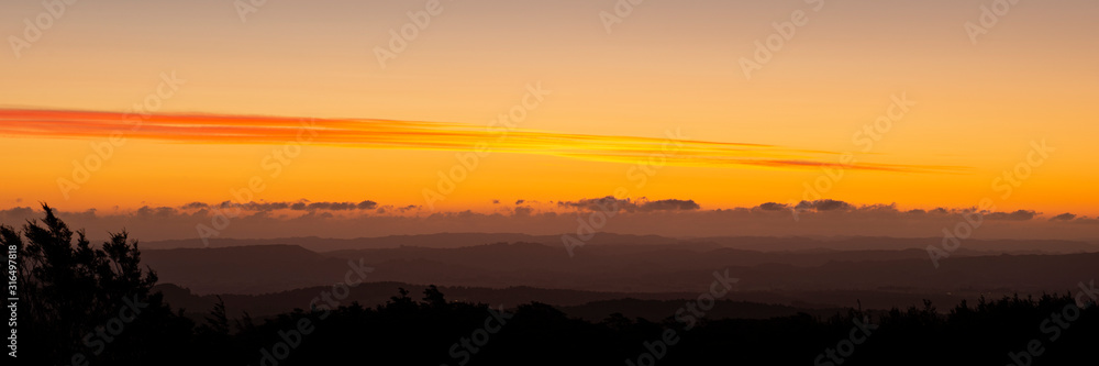 Sunset over the rolling mountains in Central Plateau. Viewed from Tongariro National Park