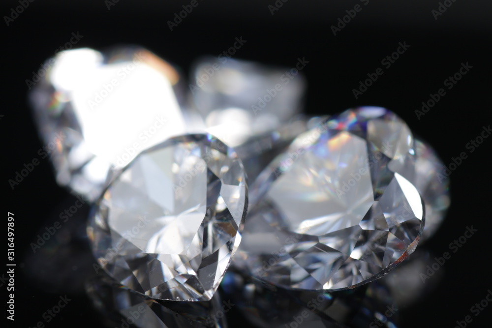 Close up shoot of shinny diamond that faceted to pear shapes isolated background Close up shoot of shinny diamond that faceted to pear shapes isolated background