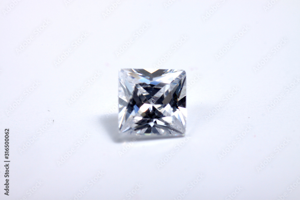 Briliant sparkling clear diamond, close up shoot on isolated background Briliant sparkling clear diamond, close up shoot on isolated background