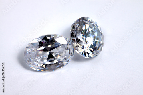 Macro shoots of a group of diamonds that has different shapes  heart  round  pear  asscher  oval  princess  isolated background