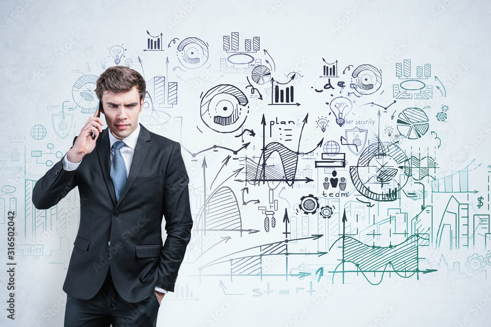 Frowning man on phone and his business plan Frowning man on phone and his business plan