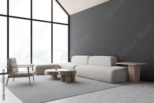 Gray attic living room corner with armchair