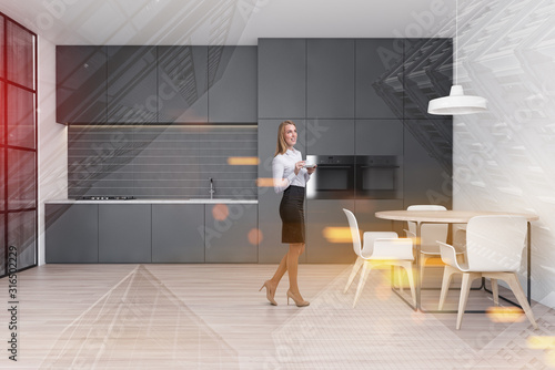 Woman in white kitchen with round table © ImageFlow