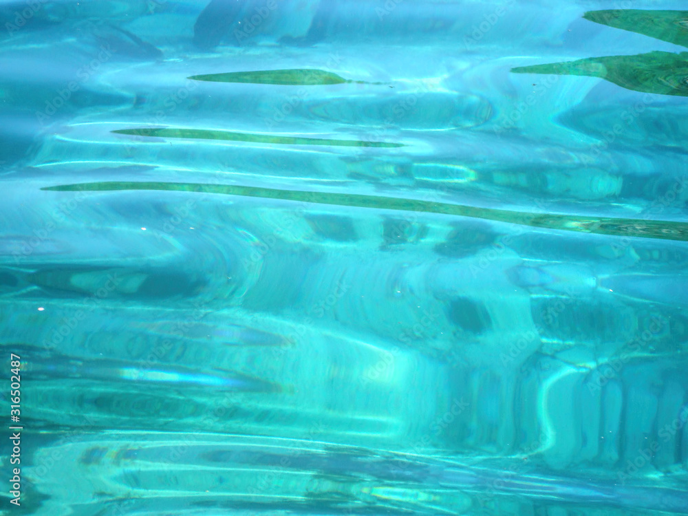 Light texture of clear blue water