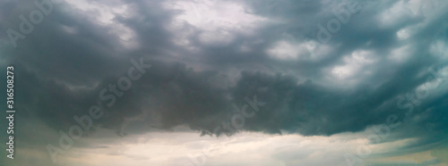 Fototapeta Naklejka Na Ścianę i Meble -  Panorama of the sky during a thunderstorm. Dark dramatic stormy sky.