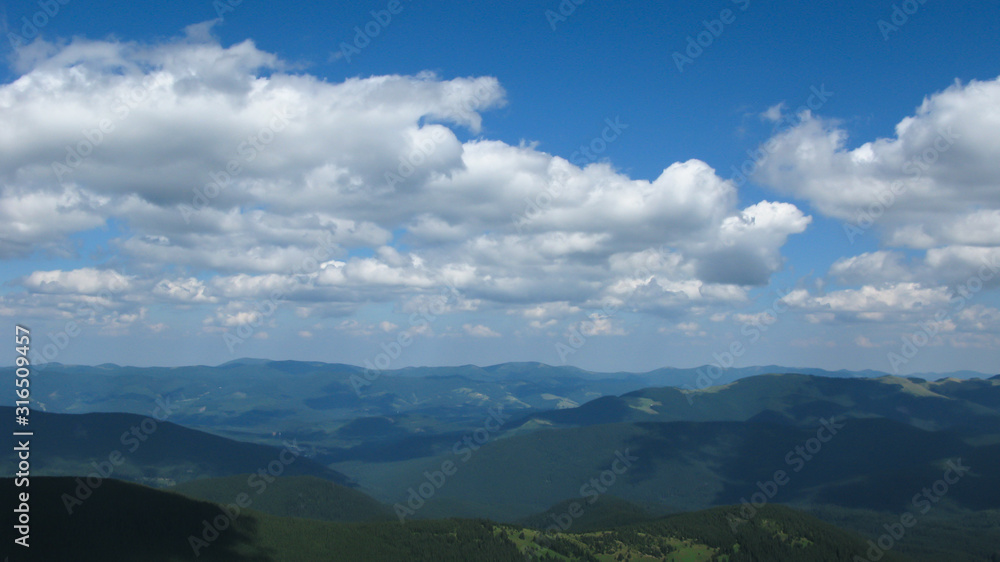 view of the Carpathian mountains on a sunny summer day from the top of Goverla Mountain, Carpathians, Ukraine