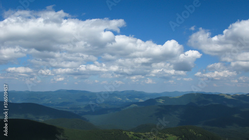 view of the Carpathian mountains on a sunny summer day from the top of Goverla Mountain, Carpathians, Ukraine