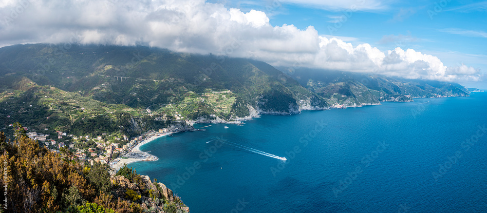 Panoramic view at Cinque Terre coastal area from Mesco Cape. Monterosso al Mare village is at left. Liguria region in Italy.