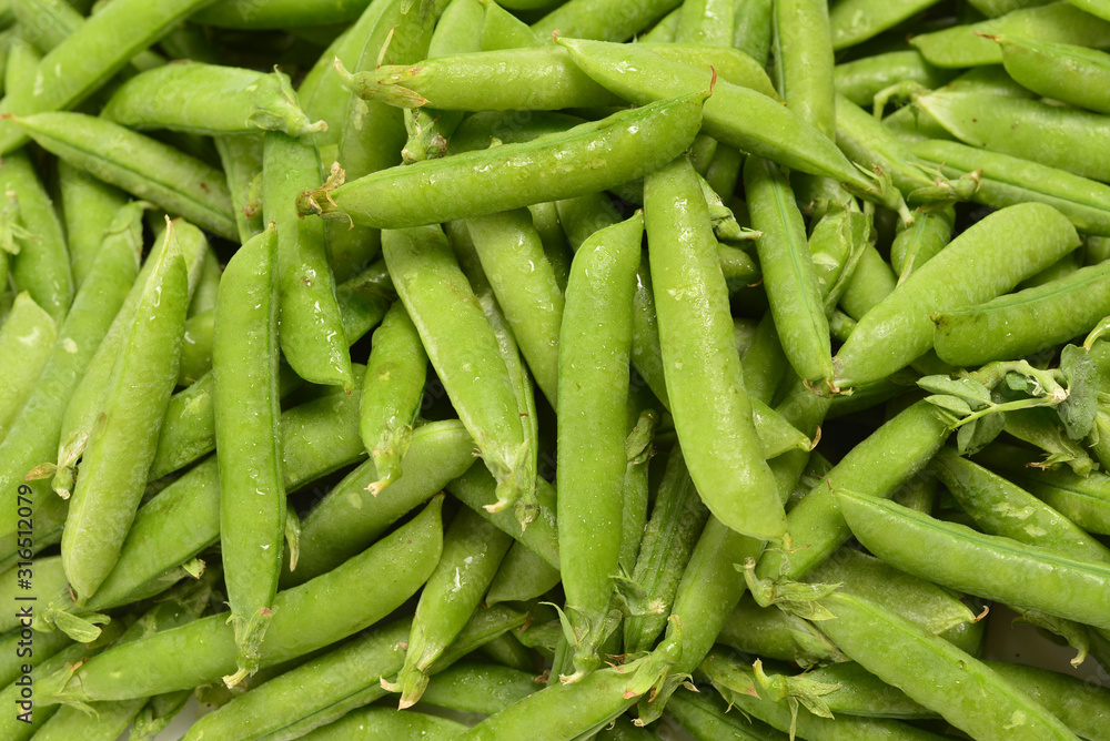Fresh pea pods as background. Top view. Fresh pea pods as background. Top view.