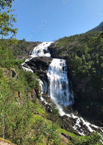 Huge waterfall in the mountains, beautiful landscape