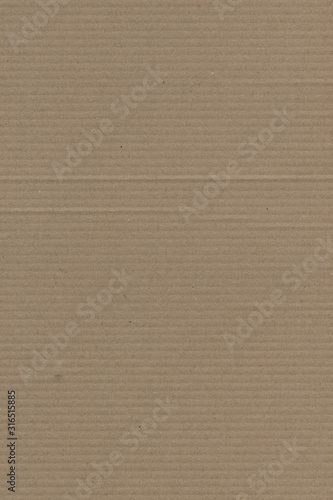 Close up grainy decorative light brown vintage rough sheet of carton. Cardboard paper texture blank background. Brown color old pattern empty papercraft surface. Recycled ecology friendly material.