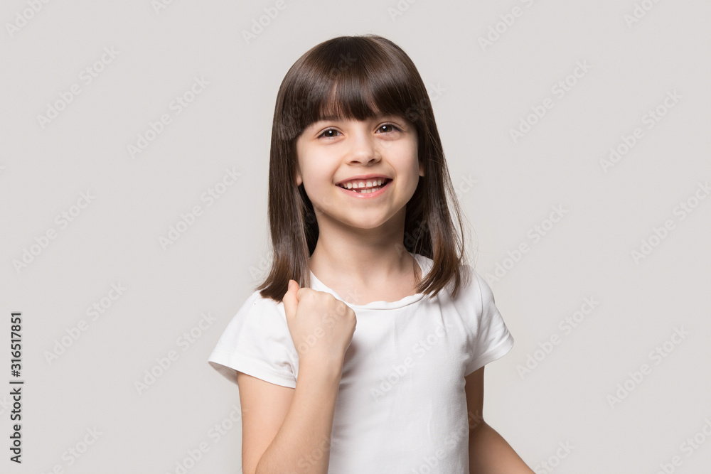 Happy adorable little preschool girl making yes gesture. Happy adorable little preschool girl making yes gesture.