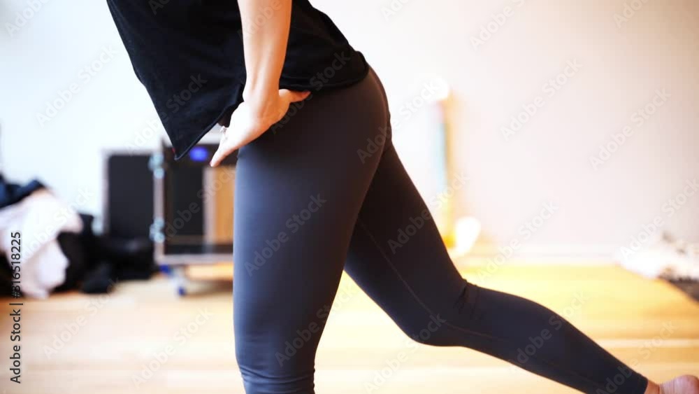 Female doing yoga in a studio with natural light Female doing yoga in a studio with natural light
