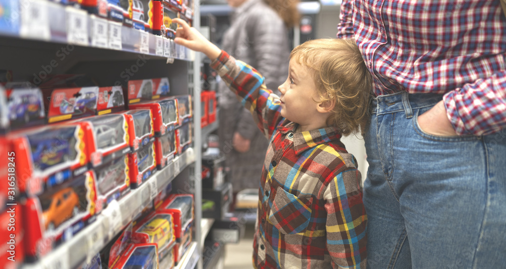 Fototapeta premium boy in toy market