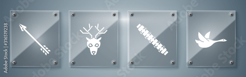 Set Flying duck, Hunting cartridge belt with cartridges, Deer head with antlers and Hipster arrow. Square glass panels. Vector