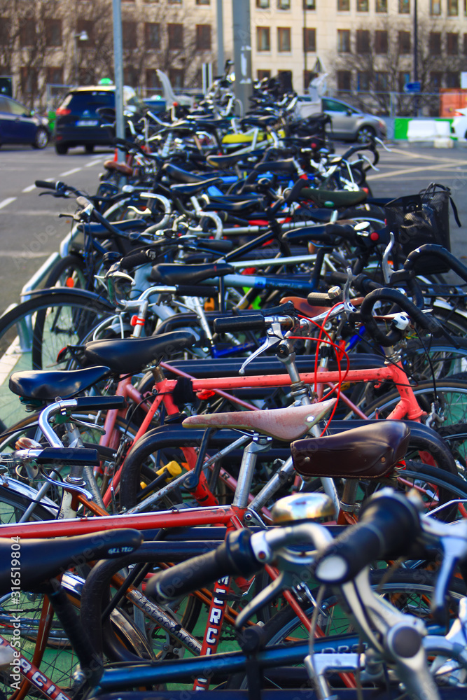 Bike pile in the street. View of means of transport with a bokeh background. Bike pile in the street. View of means of transport with a bokeh background.