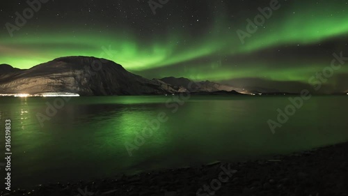 Northern lights over Lyngenfjord in Norway photo