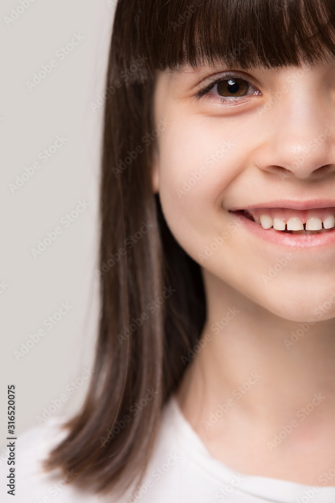 Close up head shot half face smiling little preschool girl. Close up head shot half face smiling little preschool girl.