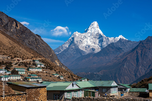 Khumjung, Nepal - November 22, 2019: Khumjung village located north of Namche bazaar on the way to Everest base camp Trekking in Nepal. Amazing view of Ama Dablam photo