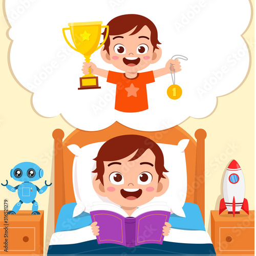 happy cute little kid boy read book and dreaming