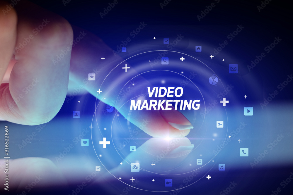 Finger touching tablet with social media icons and VIDEO MARKETING Finger touching tablet with social media icons and VIDEO MARKETING
