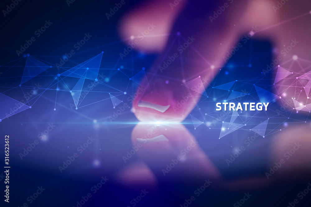 Finger touching tablet with STRATEGY inscription, business concept Finger touching tablet with STRATEGY inscription, business concept