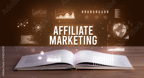 AFFILIATE MARKETING inscription coming out from an open book, creative business concept