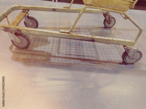 Wheels cart on grounds with light yellow