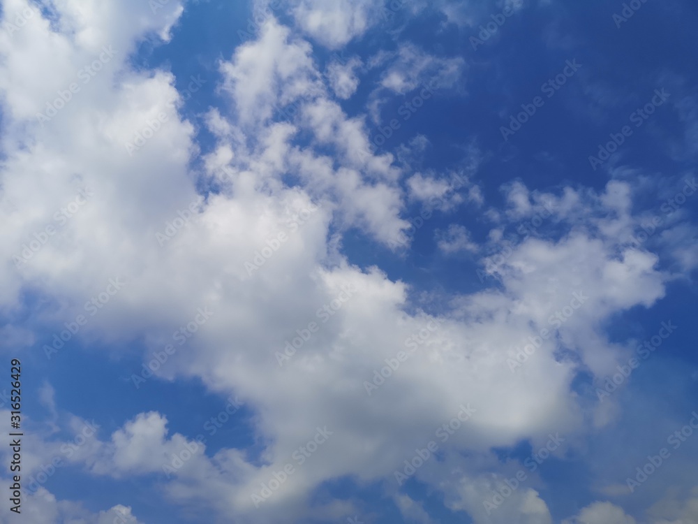 Stratocumulus, white clouds in the blue sky natural background beautiful nature environment