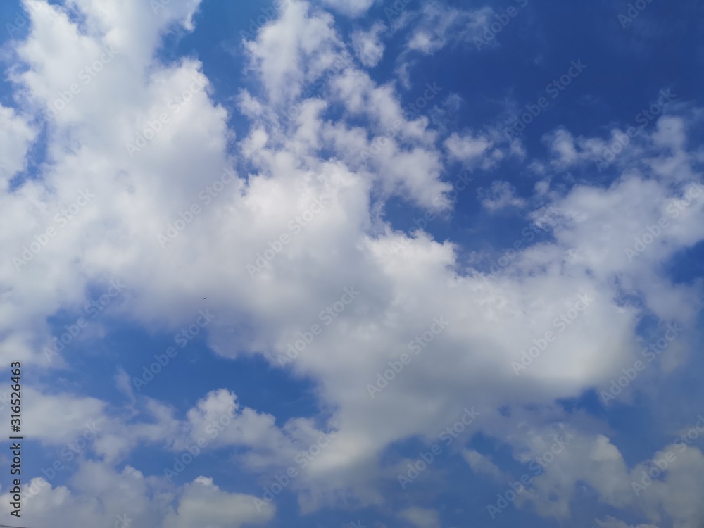 Stratocumulus, white clouds in the blue sky natural background beautiful nature environment