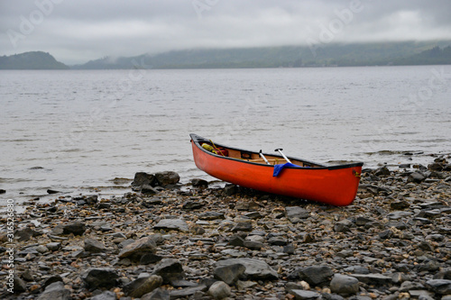 boat on the beach waiting for people to come for an adventure.  photo