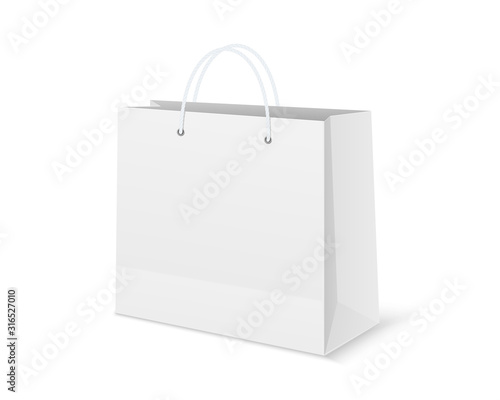 Blank shopping paper bag. Empty cardboard packet on white background.