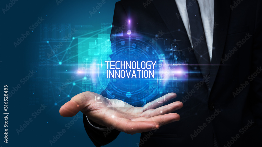 Man hand holding TECHNOLOGY INNOVATION inscription, technology concept